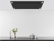 Close-up of Matte Black flush mount range hood with four integrated LED lights and perimeter suction panel for a minimalist kitchen look