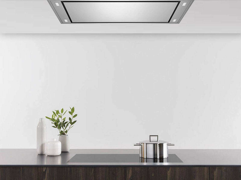 Flush stainless steel Horizon unit integrated into a modern kitchen ceiling above a cooktop.
