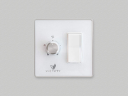 Sleek white glass Horizon wall switch for controlling fan speed and dimming lights.